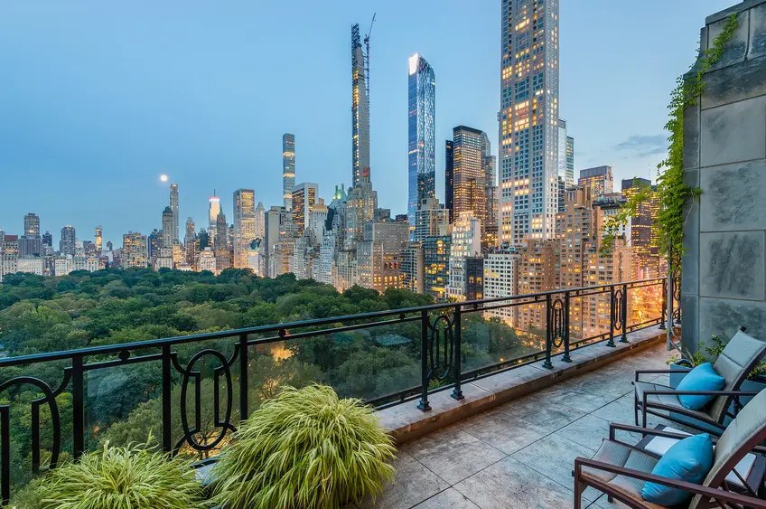 Luxury high-rise residential tower with city skyline vista